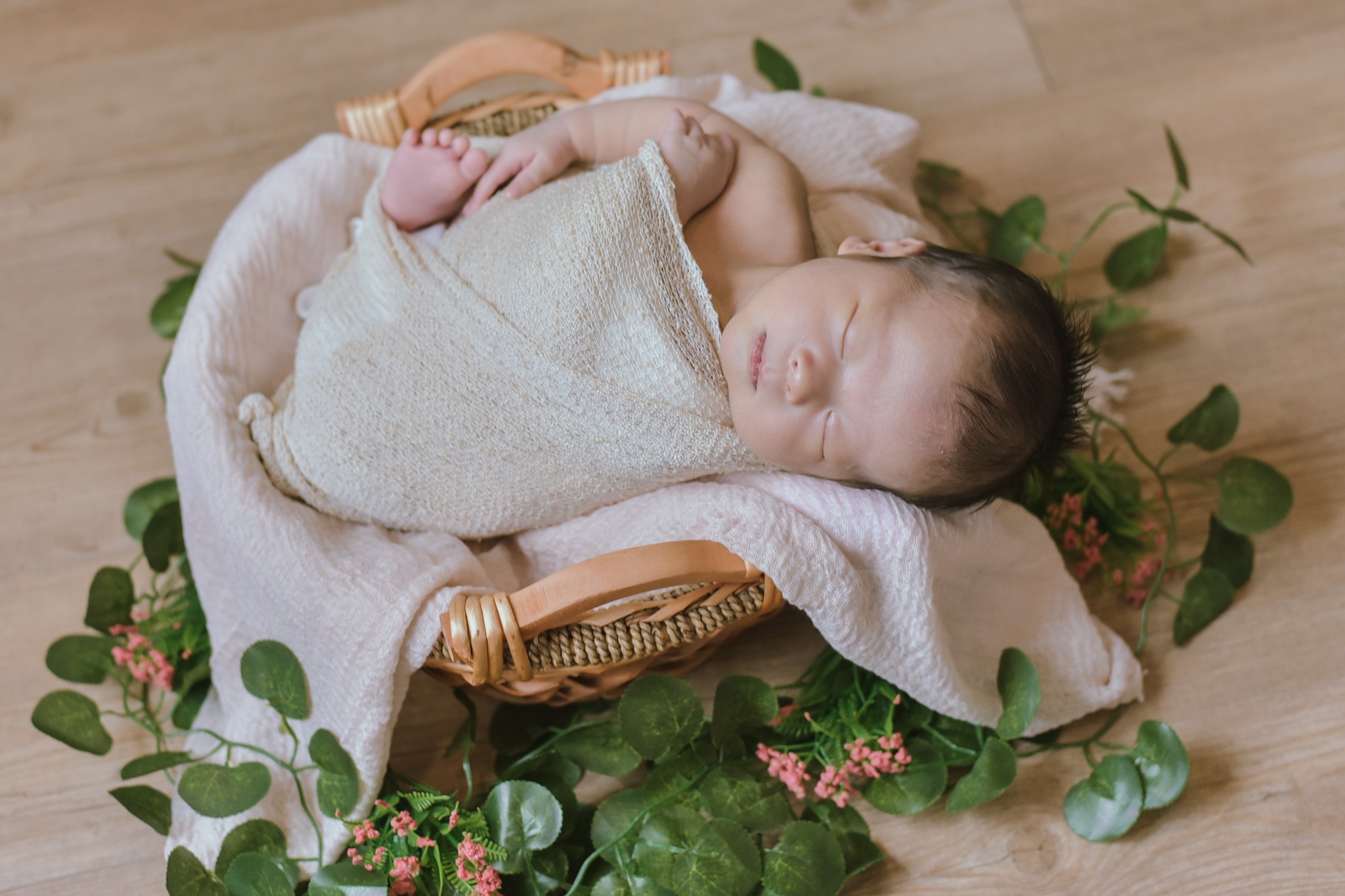 Newborn in flower basket